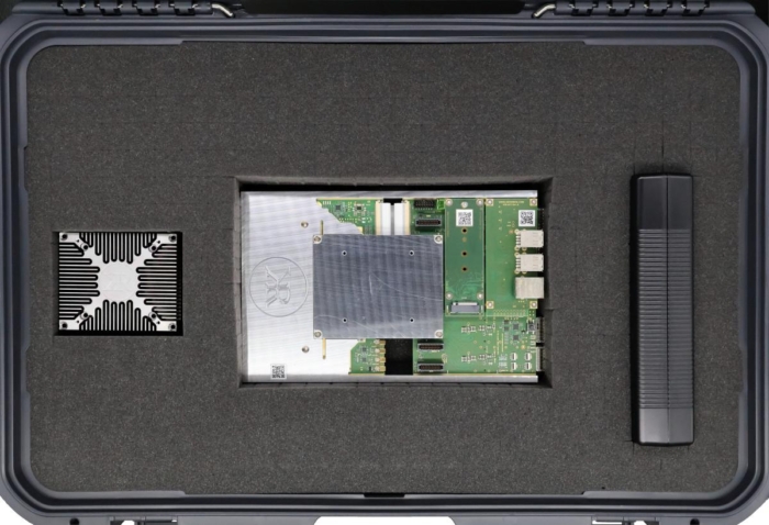 KRC-6000 evaluation carrier for KRM-6 RFSoC FPGA, heat sink, and power supply, packaged in foam-lined shipping case.